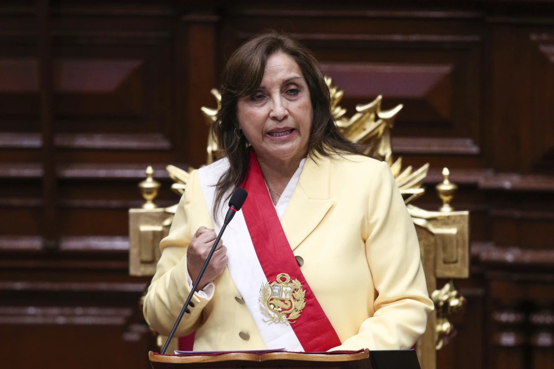 Former Vice President Dina Boluarte addresses lawmakers after being sworn-in as the new president on Wednesday in Lima.