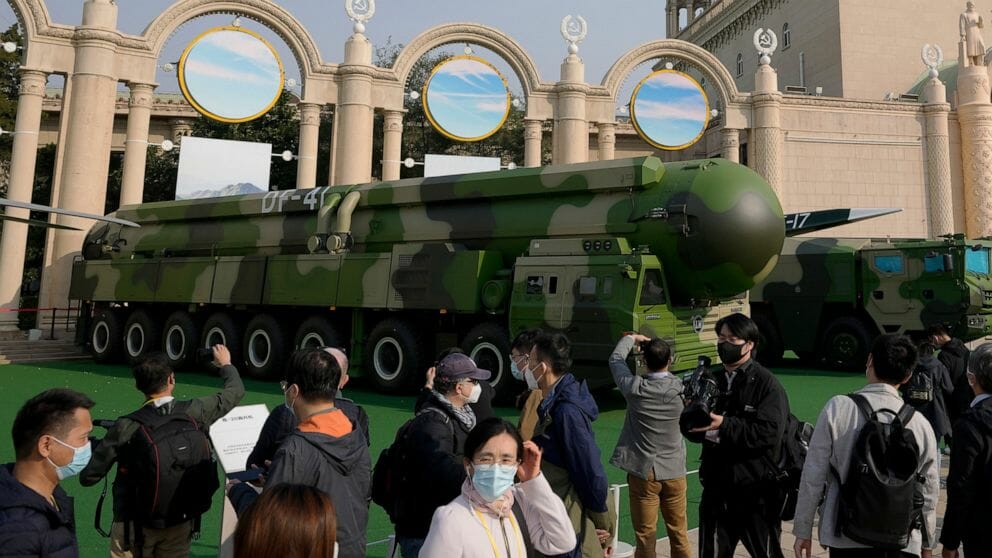 isitors tour past military vehicles carrying the Dong Feng 41 and DF-17 ballistic missiles at an exhibition highlighting President Xi Jinping and his China's achievements under his leadership, at the Beijing Exhibition Hall in Beijing on Oct. 12, 2022. China strictly adheres to its policy of no first use of nuclear weapons "at any time and under any circumstances," its Defense Ministry said Tuesday, Dec. 6, 2022, in a scathing response to a U.S. report alleging a major buildup in Beijing's nuclear capabilities.