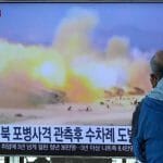 A TV screen shows a file image of North Korea's military exercise during a news program at the Seoul Railway Station in Seoul, South Korea, Wednesday, Oct. 19, 2022. South Korea’s military says North Korea has fired around 130 suspected artillery rounds Monday, Dec. 5, 2022, in waters near the rivals’ western and eastern sea borders in another display of belligerence.