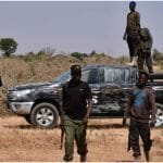 Nigerian security forces are seen on the site of a sabotage attack allegedly perpetrated by Boko Haram on the outskirts of Maiduguri on February 12, 2021.