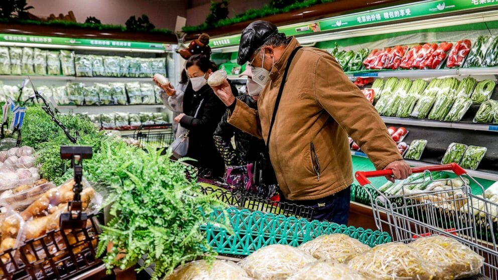 Shoppers are pictured at a supermarket in Urumqi, in China's northwestern Xinjiang region, following the easing of Covid-19 restrictions in the city, Dec. 5, 2022.