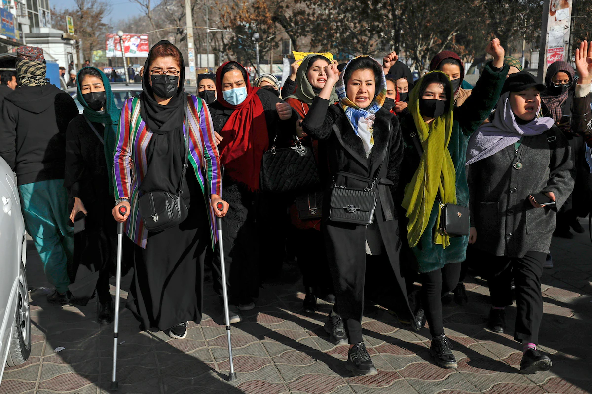 Afghan women chant slogans during a protest against the ban on university education for women, in Kabul, Afghanistan, Thursday, Dec. 22, 2022. The U.S. has condemned the Taliban for ordering non-governmental groups in Afghanistan to stop employing women, saying the ban will disrupt vital and life-saving assistance to millions. It is the latest blow to female rights and freedoms since the Taliban seized power last year and follows sweeping restrictions on education, employment, clothing and travel.
