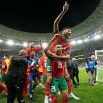 Morocco's players celebrate after winning the World Cup quarterfinal soccer match between Morocco and Portugal, at Al Thumama Stadium in Doha, Qatar, on Dec. 10, 2022.