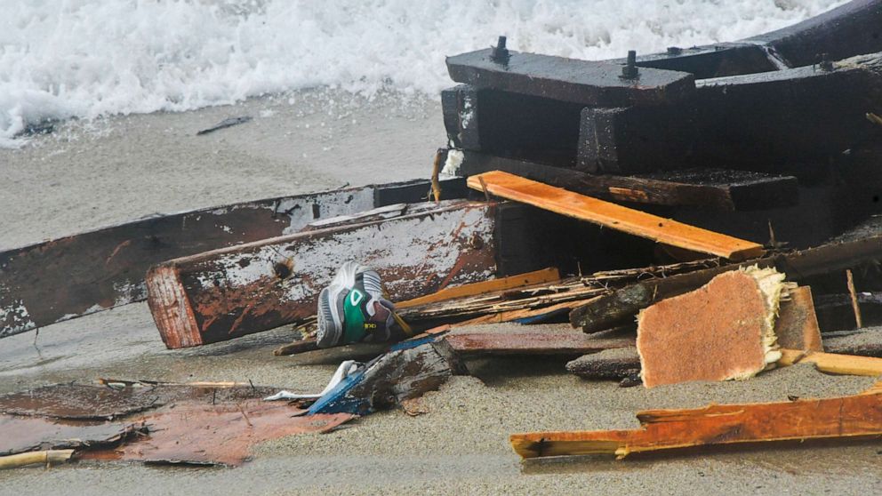 The wreckage from a capsized boat washes ashore at a beach near Cutro, southern Italy, Feb. 26, 2023.