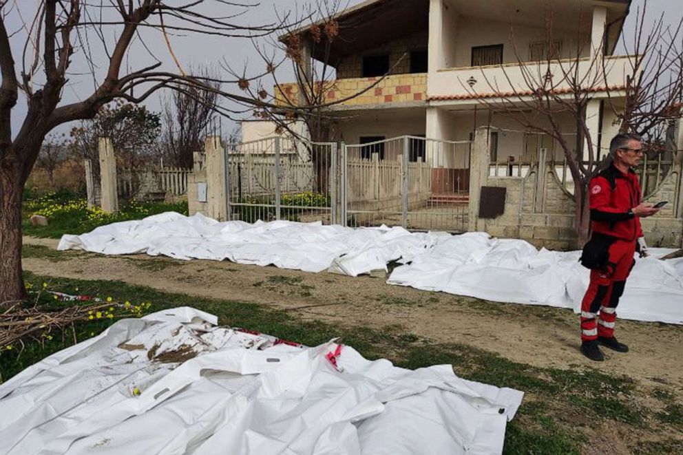 THIS PHOTO OBTAINED FROM ITALIAN NEWS AGENCY ANSA, TAKEN ON FEB- 26, 2023 SHOWS BAGS CONTAINING THE BODIES OF DECEASED MIGRANTS IN STECCATO DI CUTRO, SOUTH OF CROTONE, AFTER THEIR BOAT SANK OFF ITALY'S SOUTHERN CALABRIA REGION