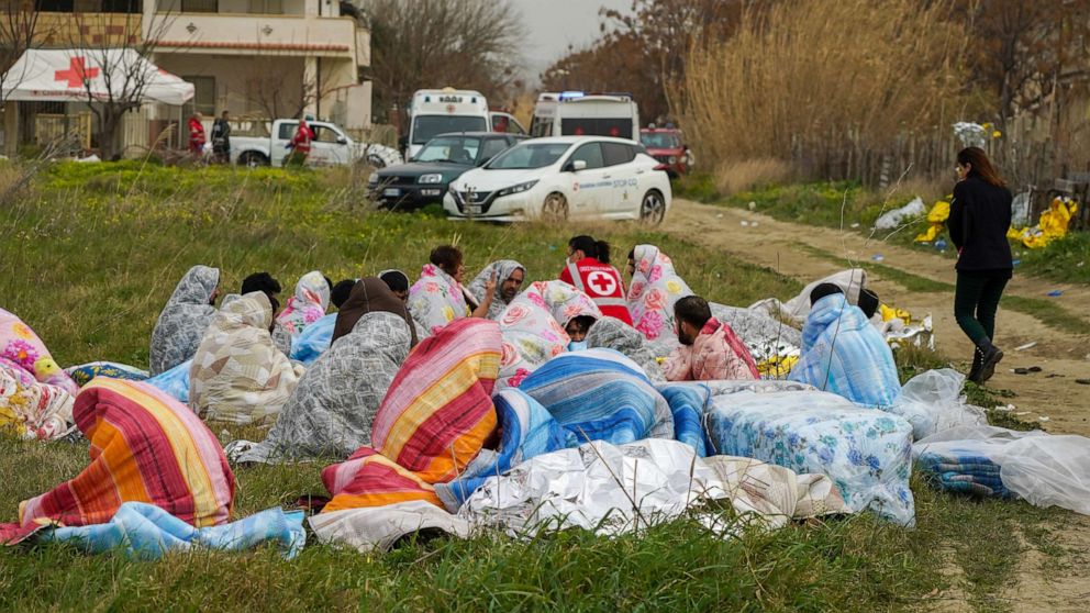 Some migrants who were saved from the shipwreck that occurred on Feb. 26, 2023, were rescued and helped and warmed by blankets in Steccato di Cutro, near Crotone, in Calabria, southern Italy