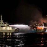 The Philippine Coast Guard sprays water on a fire onboard the Lady Mary Joy 3 during a search and rescue operation in waters off Baluk-Baluk Island in Basilan province on Wednesday. (Photo: Philippine...