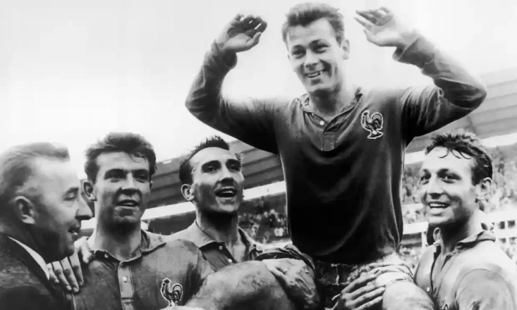 Just Fontaine is carried by his France teammates at the 1958 World Cup in Sweden.