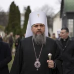 Metropolitan Epifaniy, head of the Orthodox Church of Ukraine, walks after the official ceremony of presenting certificates for Ukrainian military chaplains at Saint Sophia Cathedral in Kyiv, Ukraine, Saturday, April 1, 2023. The first group of chaplains to be officially included in the Ukrainian armed forces with military ranks graduated in a ceremony in Saint Sophia Cathedral in central Kyiv. Although the military has included chaplains before, they were not officially part of the military structure and didn't have ranks. (AP Photo/Evgeniy Maloletka)