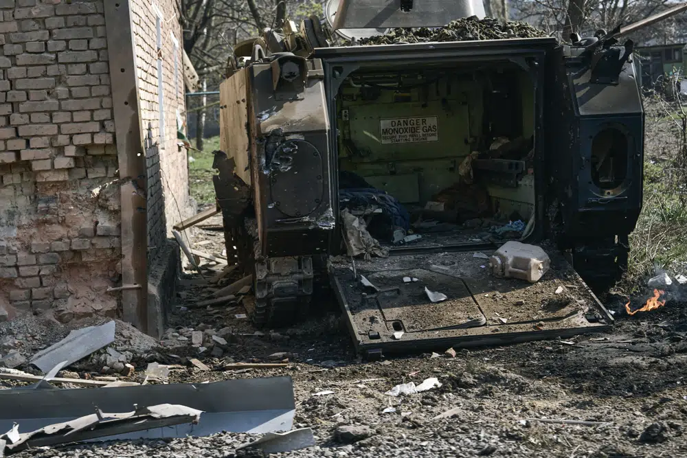 A damaged APC seen in Bakhmut, the site of heavy battles with Russian troops in the Donetsk region, Ukraine, Sunday, April 9, 2023. (AP Photo/Libkos)