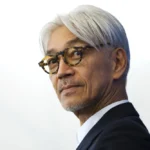 FILE - Maestro Ryuichi Sakamoto poses during a photo call for the film "Coda" at the 74th Venice Film Festival in Venice, Italy, Sept. 3, 2017. Japan's recording company Avex says Sakamoto, a musician who scored for Hollywood movies such as “The Last Emperor” and “The Revenant,” has died. He was 71. He died March 28, according to the statement released Sunday, April 2, 2023. (AP Photo/Domenico Stinellis, File)