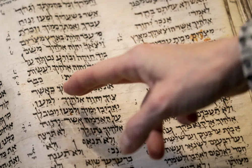 Sotheby's unveils the Codex Sassoon for auction, Wednesday, Feb. 15, 2023, in the Manhattan borough of New York. The 1,100-year-old Hebrew Bible that is one of the oldest surviving biblical manuscripts sold for $38.1 million, which includes the auction house's fee, Wednesday, May 17, 2023, in New York. (AP Photo/John Minchillo, File)