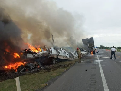 26 people die in fiery crash of freight truck and passenger van in northern Mexico